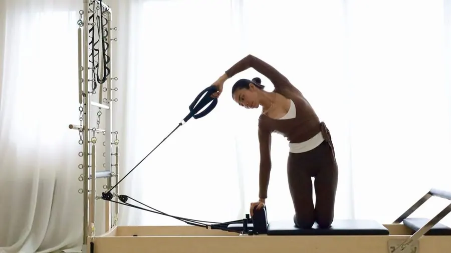 Side plank on the reformer at Move Pilates Phan Rang